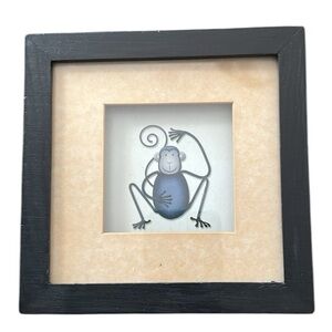 Framed monkey print.